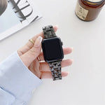 Ceramics replacement strap for Apple Watch showing rhombic grid design on wrist, compatible with multiple Apple Watch sizes.