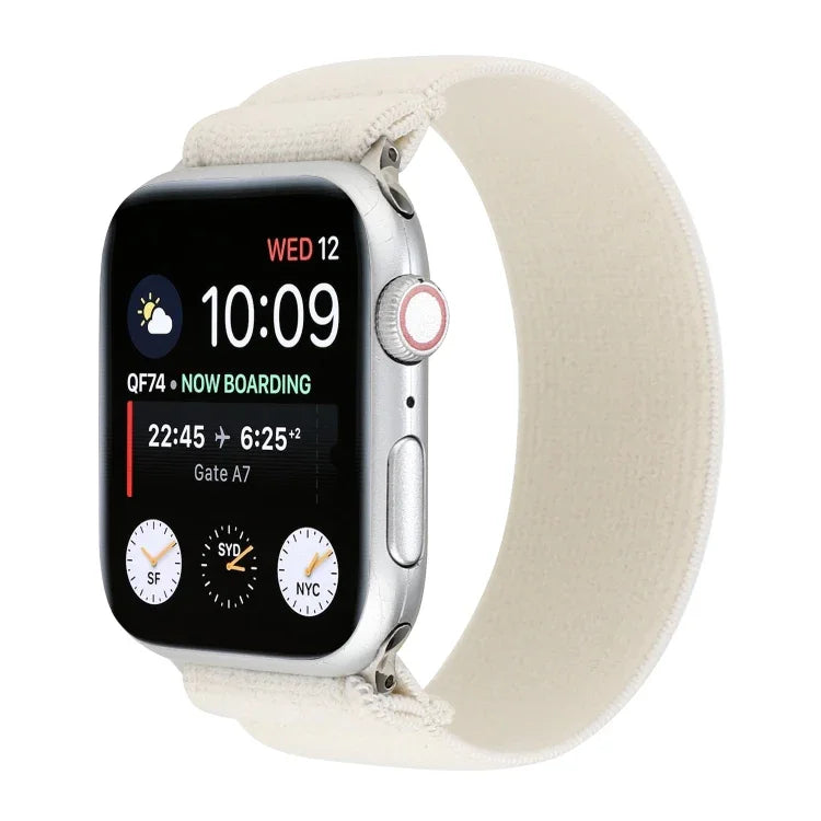 Solid color silicone replacement strap for Apple Watch on a smartwatch, showing time and notifications.