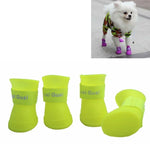 Waterproof rubber dog shoes in bright yellow color, ideal protective rain boots for small dogs.
