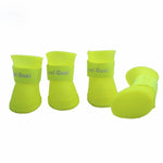 Waterproof rubber dog shoes in bright yellow color, designed for protection and comfort during rainy days.