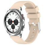 20mm silicone watch band for Samsung Galaxy Watch on a beige strap with a stylish watch face.